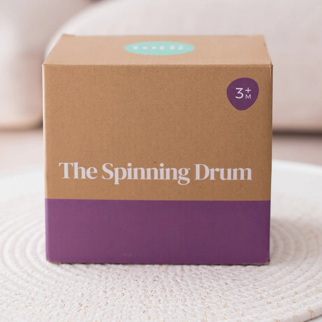 Totli - The Spinning Drum in its packaging box.